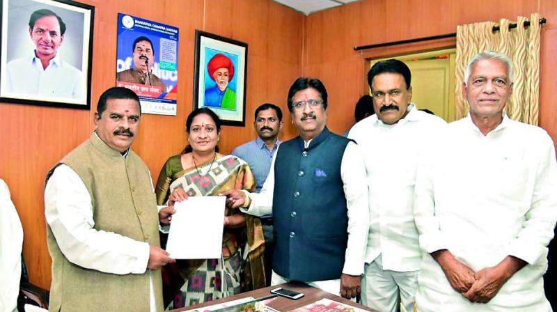 Four Congress MLCs meet Telangana Legislative Council chairman Swamy Goud to submit a memorandum to merge the Congress Legislative Party with the TRS Legislative party on Friday. 	 DC