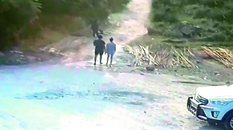 A CCTV screengrab, which was captured near the spot where Chandinis body was found, shows her walking with an unidentified boy.  (Photo:DC)