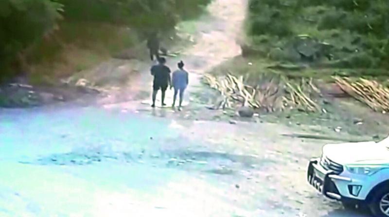 A CCTV screengrab, which was captured near the spot where Chandinis body was found, shows her walking with an unidentified boy. 	(Photo:DC)