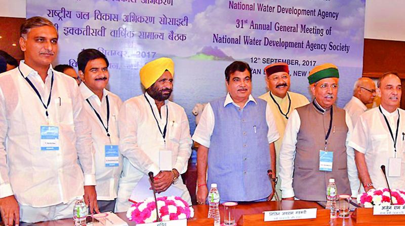 TS irrigation minister T. Harish Rao, AP water resources minister Devineni Uma Maheswara Rao and Union minister Nitin Gadkar prepare to discuss interlinking of rivers, in New Delhi on Tuesday.