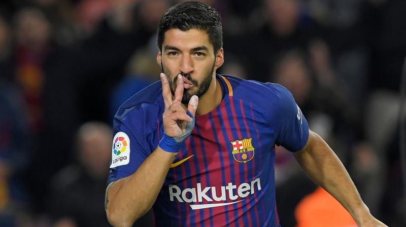 Luis Suarez broke Valencias resolve in the semi-final first leg by leaping to meet a cross from Lionel Messi in the 67th minute, scoring a 12th goal in 10 games in all competitions to leave Valencia needing to win by two goals in next Thursdays second leg at Mestalla to advance to their first final in a decade.(Photo: AFP)