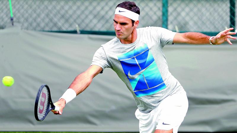 Switzerlands Roger Federer at a training session in London on Sunday, the eve of the Wimbledon Championships. (Photo: AP)