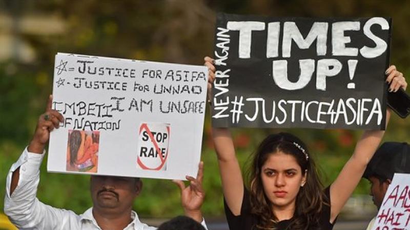 People take part in a protest demanding justice for the victims of Kathua and Unnao rape cases, in Mumbai on Sunday. (Photo: PTI)