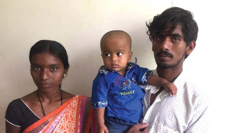 One-year-old Abhiram with his parents.