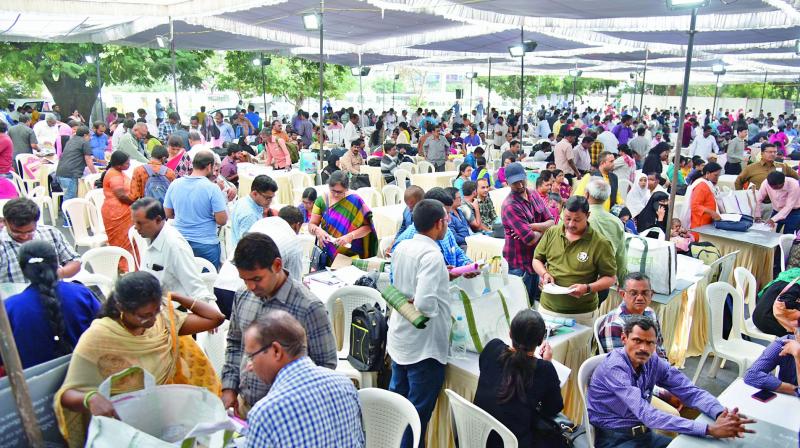 Booth-level officials collect polling materials from the State Election Commissions distribution centre at Wesley College Ground in Secunderabad on Thursday.  (DC)