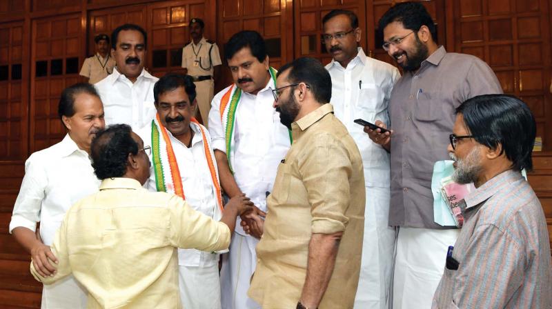 Speaker P.Sreeramakrishnan and law minister A.K. Balan visit the UDF MLAs who are on an agitation outside the Assembly hall on Thursday.