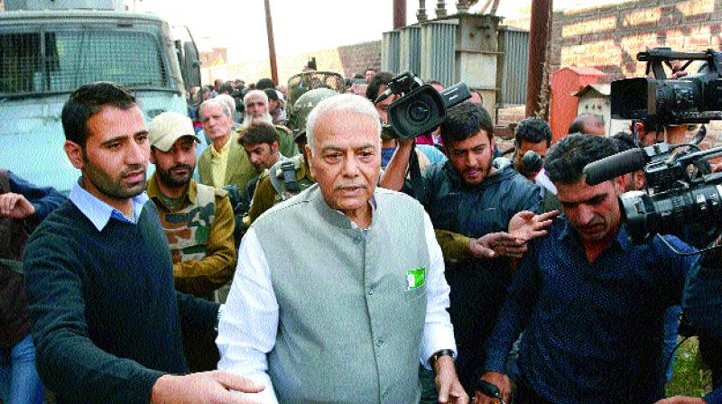 Former Union minister Yashwant Sinha leaves after meeting the chairman of Hurriyat Conference, Syed Ali Shah Geelani in Srinagar on Tuesday 	(Photo:PTI)