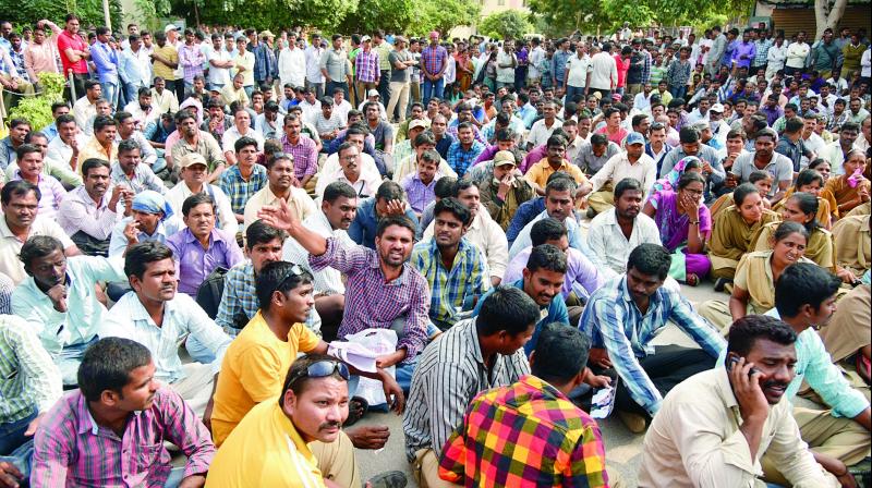 Homeguards stage a protest at the Gandhi Hospital on Tuesday in Hyderabad asking the government to grant their demands. 	(Photo: DC)