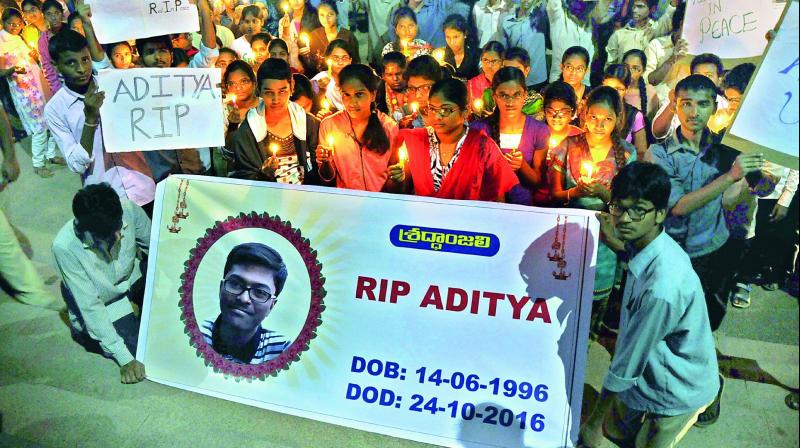 Friends of M. Aditya, a second-year student of Osmania Engineering College, hold a candle light rally on Tuesday in his memory.  (Photo: DC)