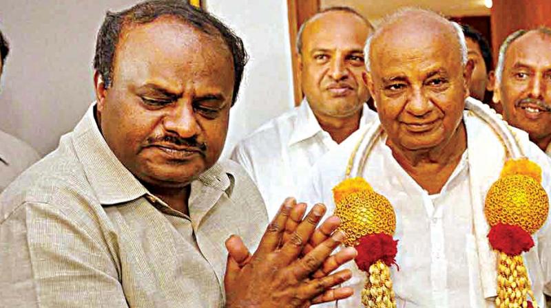 Former Prime Minister H.D. Deve Gowda and son and JD(S) state president H.D. Kumaraswamy in a file photograph