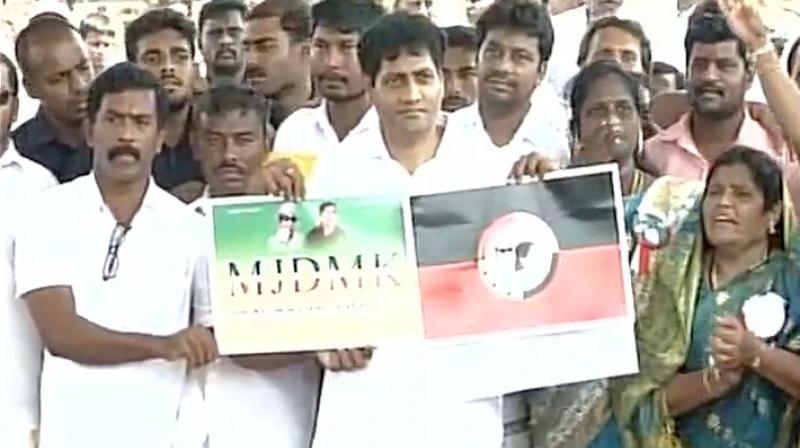 Madhavan with party workers after launching MJDMK at Marina beach in Chennai on Friday. (Photo: ANI Twitter)