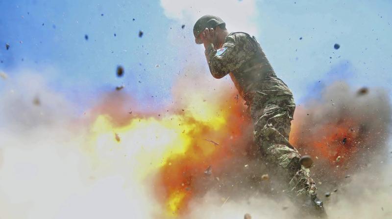 Hilda Clayton took this photo July 2, 2013 that was released by the U.S. Army, that shows an Afghan soldier engulfed in flame as a mortar tube explodes during an Afghan National Army live-fire training exercise in Laghman Province, Afghanistan. (Photo: AP)