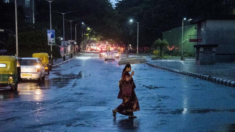 Heavy thunderstorm hit across Bengaluru on Monday evening, bringing down three trees and plunging several areas into darkness. (Photo:DC)