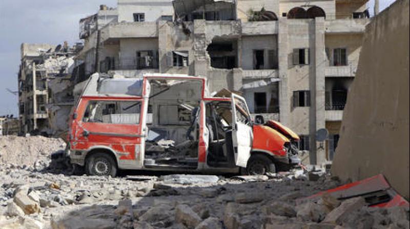 A destroyed ambulance is seen outside the Syrian Civil Defense main center after airstrikes in Ansari neighborhood in the rebel-held part of eastern Aleppo. (Photo: AP)