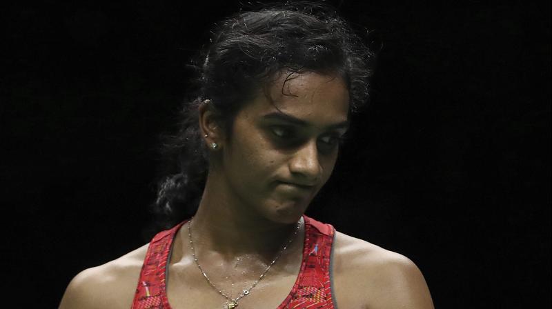 PV Sindhu suffered an unexpected 17-21, 21-16, 18-21 defeat at the hands of Beiwen Zhangin to make a first-round exit from the Denmark Open Super Series. (Photo: AP)