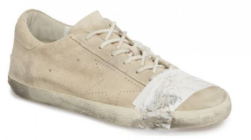 The crumbly Superstar Tape Sneaker are being sold at a whopping 530 USD  which is approximately Rs. 38,000 (Photo: Twitter)