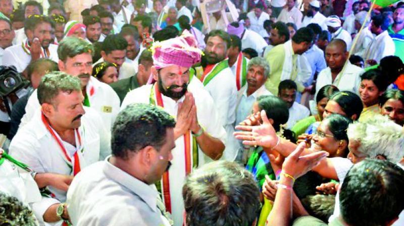 TPCC chief N. Uttam Kumar Reddy greets supporters in Huzurnagar on Thursday. (Photo: DC)