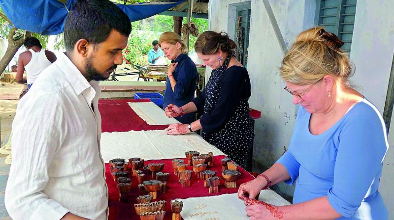 Artists from Netherlands trying their hand at  Kalamkari at Pedana in Krishna district. 	 (DC)