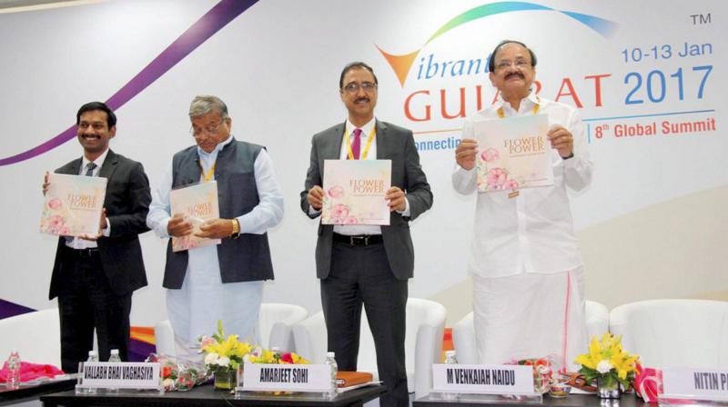 Union I & B Minister M Venkaiah Naidu releases a publication during the Vibrant Gujarat Global Summit 2017 at Mahatma Mandir in Gandhinagar, Gujarat. (Photo: PTI)