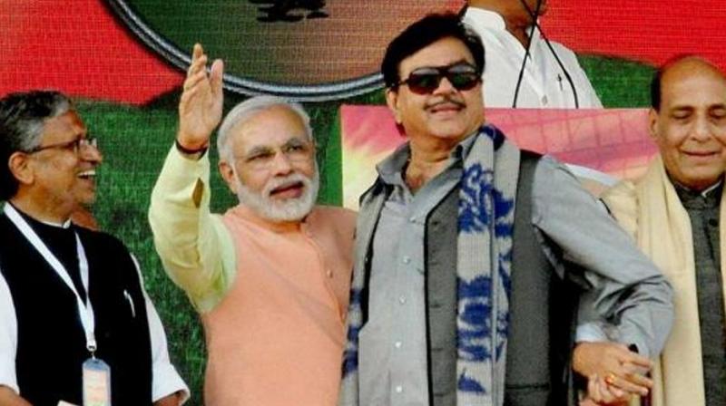 File photo of BJP MP Shatrughan Sinha with Prime Minister Narendra Modi, home minister Rajnath Singh and Bihar BJP leader Sushil Kumar Modi at a rally in Patna. (Photo: PTI)