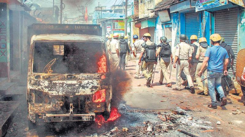 Police personnel patrol after clashes and incidents of arson over a Ram Navami procession in Raniganj, in Burdwan district of West Bengal. (Photo: PTI/File)