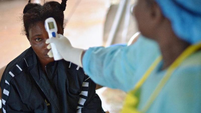 A woman being checked at a medical camp for ebola treatment. (Photo: AFP)