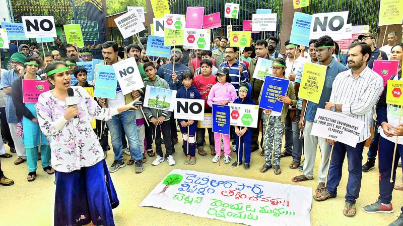 Citizens protest against a notification issued to shrink the KBRs eco-sensitive zone at KBR Park, main entrance, on Sunday.(Image DC)
