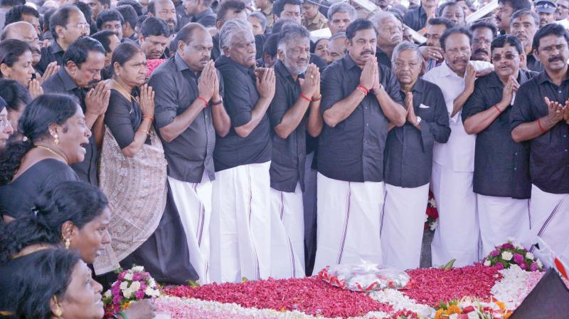 Chief Minister Edappadi K. Palaniswami and Deputy Chief Minister O. Panneerselvam along with senior leaders pay homage to late J. Jayalalithaa observing her first death anniversary near her memorial on Tuesday. (Photo: DC)