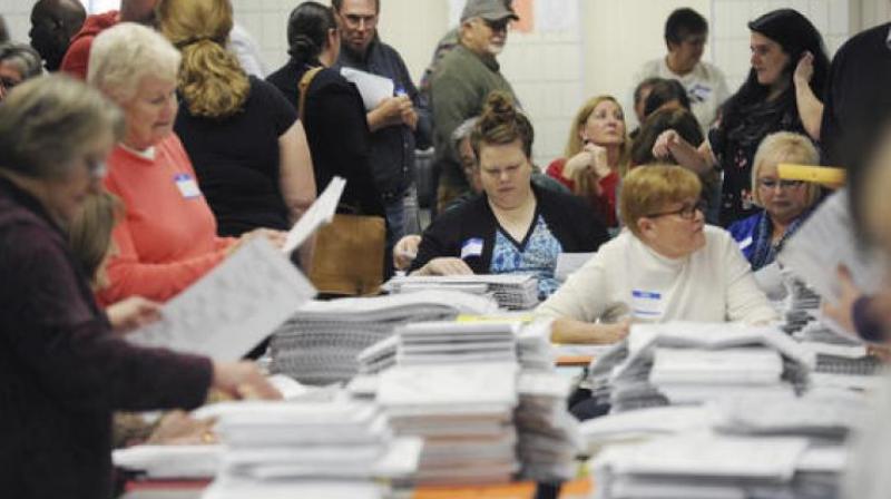 Workers recount Berrien County presidential ballots at the South County Courthouse in Niles, Michigan. (Photo: AP)
