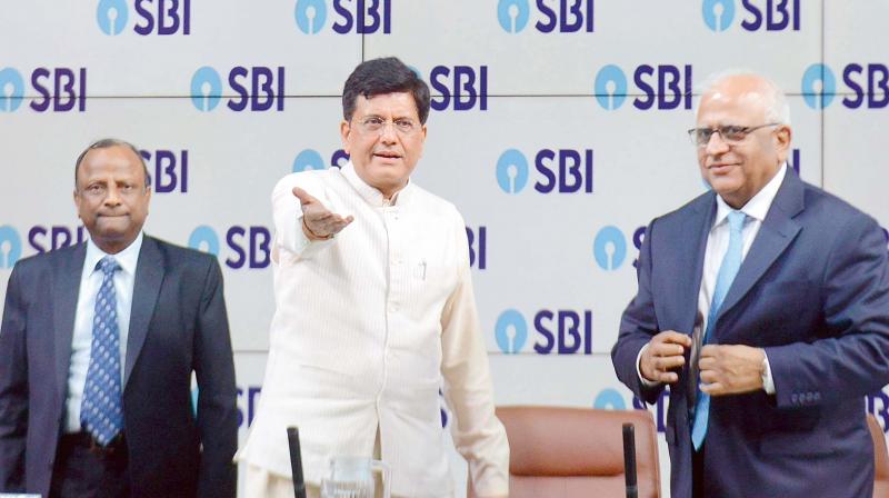 Union finance minister Piyush Goyal (centre) is seen along with SBI chairman Rajnish Kumar (left) and PNB Chairman Sunil Mehta (right) ahead of the press conference organised by SBI in Mumbai on Friday.  (Photo:Debasish Dey)