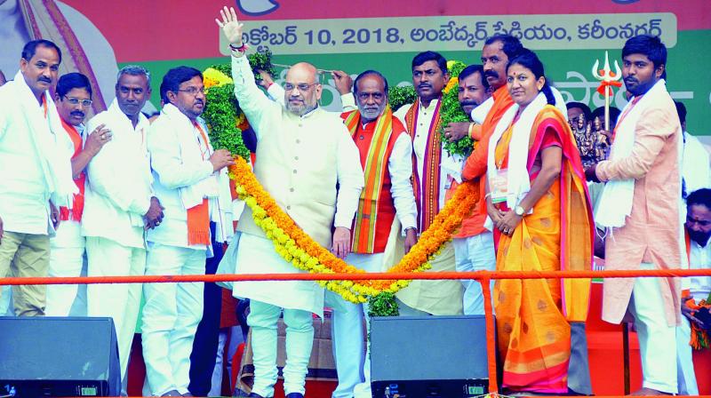 BJP ledars welcome party president Amit Shah during a meeting at Exhibition Grounds in Hyderabad on Wednesday.  (Photo:S. Surender Reddy)