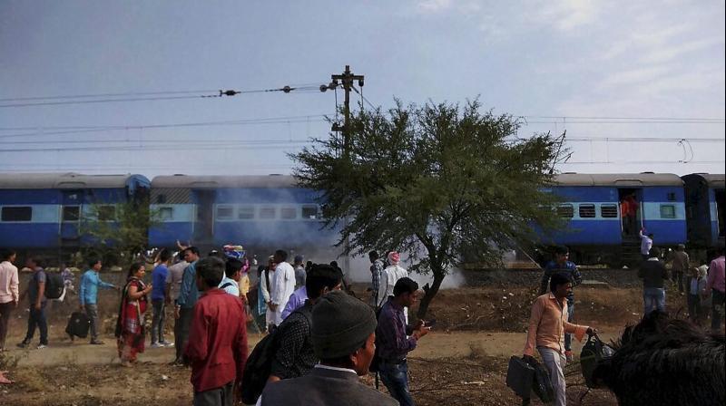 Smoke erupts from a bogie after a blast in the Bhopal-Ujjain passenger train near Jabdi station in Shajapur district in Madhya Pradesh. (Photo: PTI)