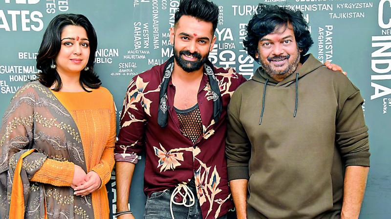 Charmee and Puri Jagannath with Ram at the launch.
