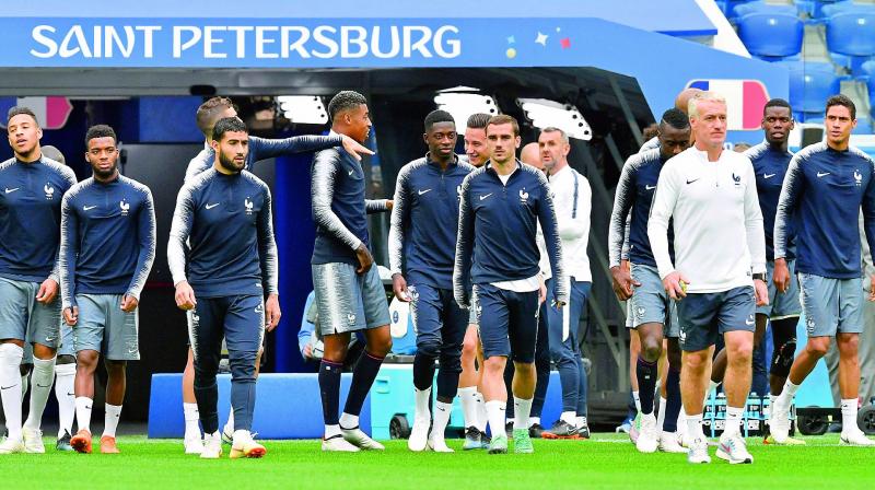 French players warm-up before training sessions ahead of their World Cup final to be played at the Luzhniki Stadium in Moscow on Sunday.