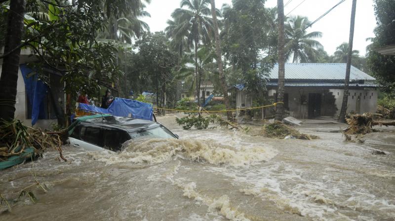 Landslides triggered by heavy monsoon rains killed more than a dozen people, cutting off road links and submerging several villages in Kerala. (Photo: AP)