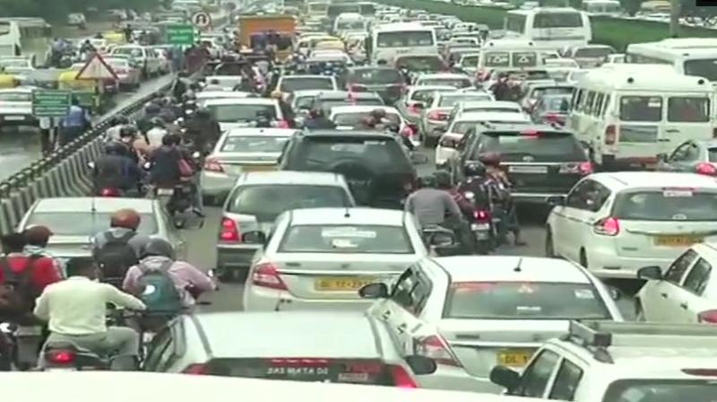 Traffic jam at Delhi-Jaipur Expressway due to waterlogging caused by heavy rainfall in parts of Delhi-NCR. (Photo: Twitter | ANI)