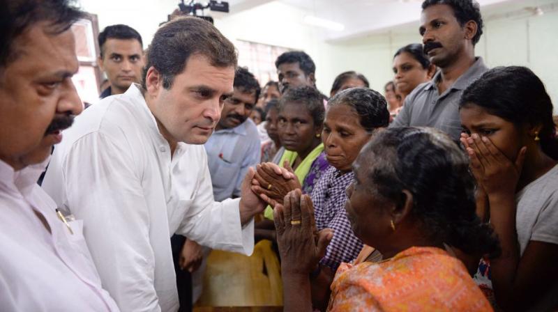 Congress President Rahul Gandhi meets flood affected at the Relief Camp at the Engineering College in Chengannur. (Photo: Twitter | @INCIndia)