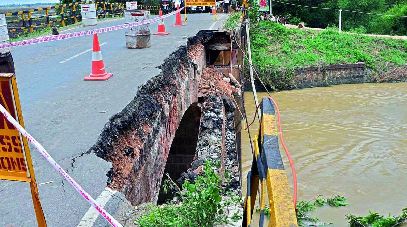 The old bridge which was constructed in the year 1936 on Kommuru canal at Cherbrolu village broke down during an accident on Friday. (Photo: DC)