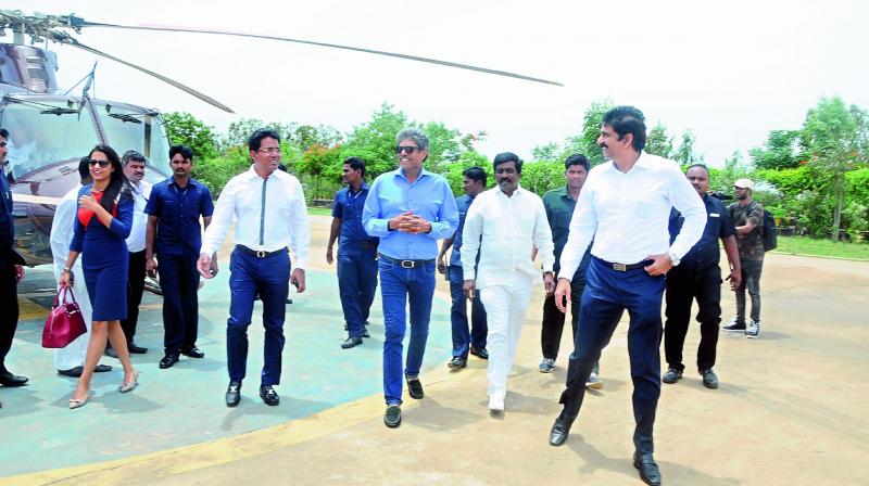 Cricketer Kapil Dev is seen along with KPCL MD Sasidhar (left) and CEO Anil Yendluri (right) at the Krishnapatnam Port on Friday.