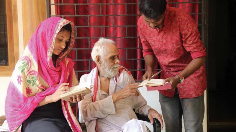 Researchers from Calicut University with P.N Nambeesan checking his diary notes. (Photo: DC)