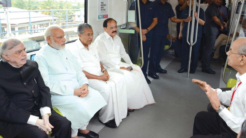 Prime Minster Narendra Modi, Governor P. Sathasivam, Chief Minister Pinarayi Vijayan and Union minister Venkaiah Naidu are all ears as DMRC principal advisor E. Sreedharan explains about the Kochi Metro on Saturday.