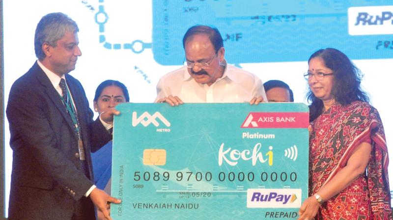 Union minister Venkaiah Naidu launches the Kochi One Smart card along with KMRL Managing Director Elias George and Axis bank Managing Director & CEO Shika Sharma in Kochi on Friday. (Photo: SUNOJ NINAN MATHEW)