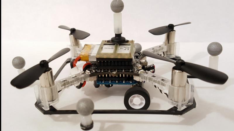 One of the researchers quadcopter drones with wheels.  Photo: Brandon Araki/MIT CSAIL