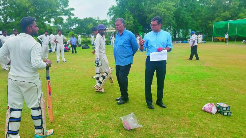 Member of the Hyderabad Cricket Associations Senior Selection Committee Srinivas Chakravarthy (left) and P. Vijay Kumar, chairman of the Junior Selection Committee, interact with players who had turned up for the HCAs open selection trials at the Gymkhana grounds in Secunderabad on Monday.