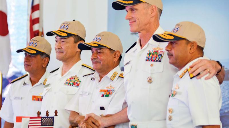 Top Navy officials from India, US and Japan address the press aboard INS Jalaswa on Monday.(Photo: DC)