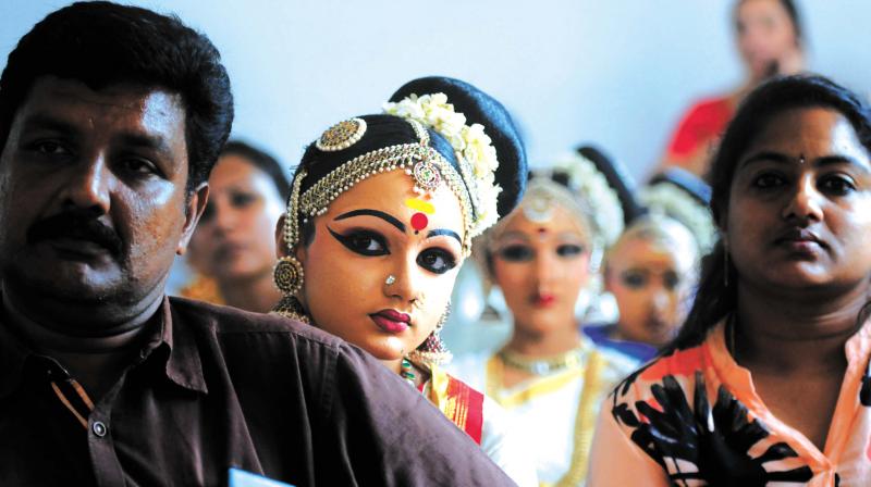 A participant watches other contestants perform during the mohiniyattam competition. 	(Photo:  DC)