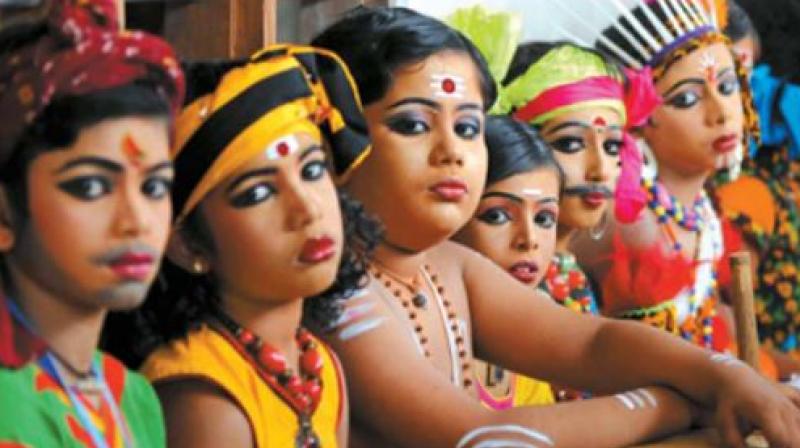 Participants of Category 2 folk dance wait patiently for their turn to go on stage.