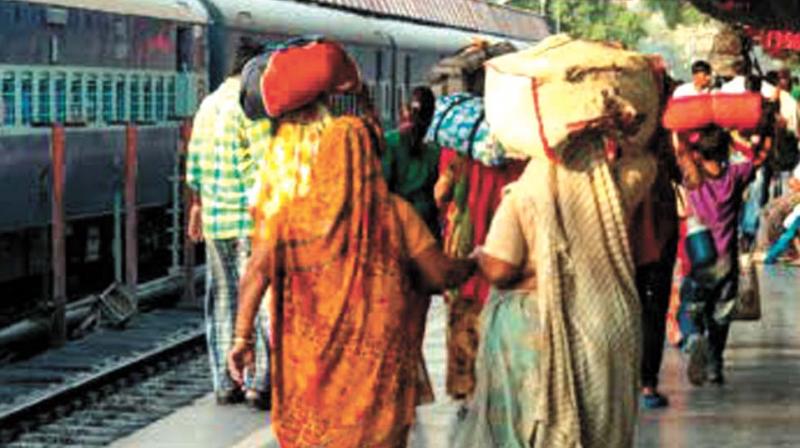 Passengers seen carrying their own luggage at Kozhikode railway station on Thursday.