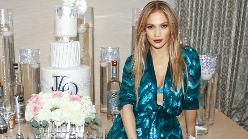 Jennifer Lopez looks dapper in this sequined green jumpsuit