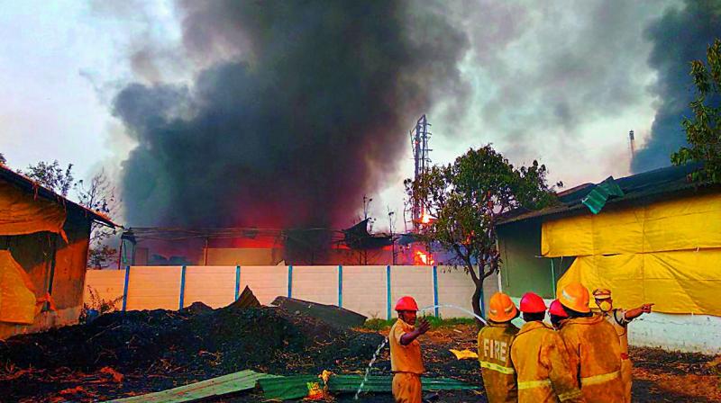 Fire men douse the fire that broke out at Maha Shiva factory at Sangareddy on Friday.